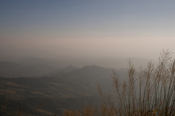 Wall Mural - View of hill with mist and blue sky background, Phu Langka national Park, Phayao, Thailand.