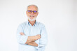 © Danko - Happy Mature Man With Arms Crossed over white background.