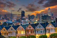 Alamo Square And Painted Ladies With San Francisco Skyline In The Evening Hour
