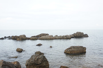 unusual sandstone emerging from the sea. reef rocks on natural background.