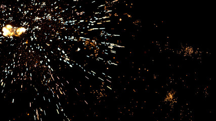 Sticker - Fireworks background with blurred lights on black background