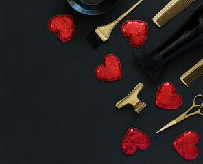 Hairdressing tools in gold and black on a dark gray background. Hair salon accessories and hearts with space for text.