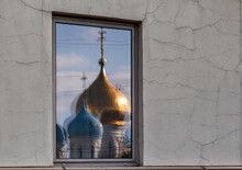 Reflection Of The Domes Of The Temple In The Window Of A Modern Building.