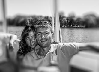 Canvas Print - Happy young couple  on a boat cruise