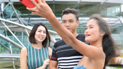 Canvas Print - Asian friends outdoor having fun visiting city