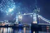 Fototapeta Londyn - Famous Tower Bridge in the evening with fireworks, London, England