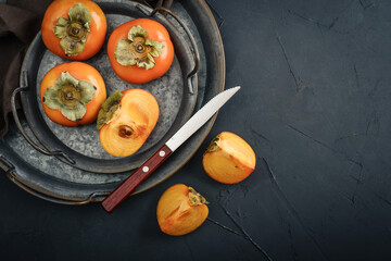 Wall Mural - Fresh organic ripe Persimmons fruits