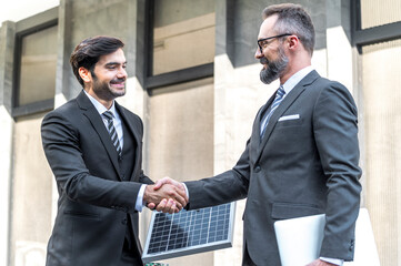 two businessman shake hands after success deal new project power solar cell solution business plan o