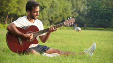 Man Playing Guitar In Park Handsome Young Asian Guitarist Playing Guitar