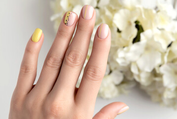 Womans hands with spring summer nail design