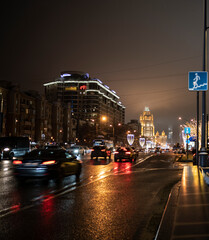 evening winter cityscape on the eve of the new year with dedicated buildings and illumination