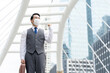 © suphaporn - Portrait asian business man wearing protective face mask for protection during the quarantine Coronavirus covid 19 outbreak ,senior visionary executives leader with business vision
