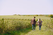 © hetmanstock2 - Man and woman in a field on spring day. Couple in love spend time in spring field. Grass on background.