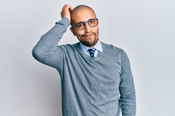 Poster - Hispanic adult man wearing glasses and business style confuse and wonder about question. uncertain with doubt, thinking with hand on head. pensive concept.