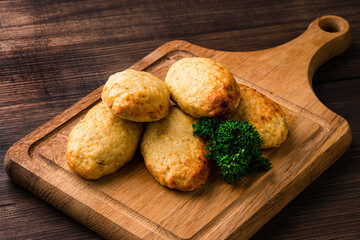 Poster - chicken cutlets with herbs on a dark wooden background, homemade chicken cutlets Free copy space