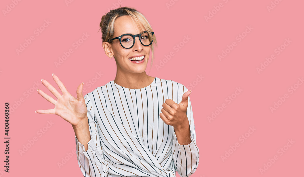 Beautiful blonde woman wearing business shirt and glasses showing and pointing up with fingers number six while smiling confident and happy. - obrazy, fototapety, plakaty 