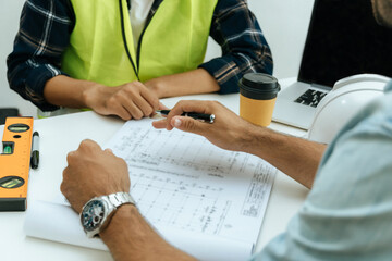 Wall Mural - engineer, architect, construction worker team working and planning on drawing blueprint on workplace desk in meeting room office at construction site, contractor, teamwork, construction concept