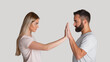 © Prostock-studio - Resist domestic tyrant. Concentrated woman pushes male hands with hands, staring at each other menacingly