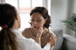 © fizkes - Close up caring grownup daughter comforting soothing upset mature mother, touching shoulder, showing empathy, young woman helping to middle aged mum to overcome problems, divorce or disease