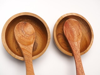 Group of antique wooden dishware that contain spoon, bowl, shoot on a white isolated background