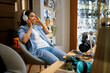 © Nomad_Soul - Customer trying on headphones in audio store