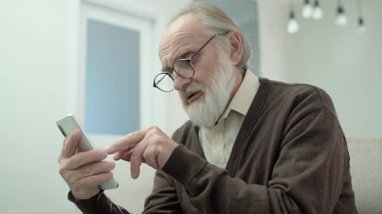 confused aged man learning to use smartphone, modern technology, generation