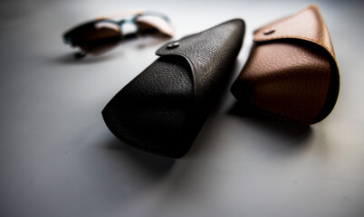 glasses and cases on a black background