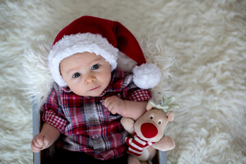 Sticker - Christmas portrait of cute little newborn baby boy, dressed in christmas clothes