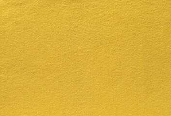 Bright illuminating yellow knitted clothes. Concept of color of year 2021. knitted texture background.