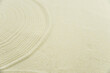 © strigana - Zen sand garden meditation stone background with copy space. Stones and lines drawing in sand for relaxation. Concept of harmony, balance and meditation, spa, massage, relax. Set Sail Champagne color