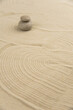 © strigana - Zen sand garden meditation stone background with copy space. Stones and lines drawing in sand for relaxation. Concept of harmony, balance and meditation, spa, massage, relax. Set Sail Champagne color