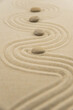 © strigana - Zen sand garden meditation stone background with copy space. Stones and lines drawing in sand for relaxation. Concept of harmony, balance and meditation, spa, massage, relax. Set Sail Champagne color