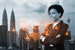 Smiling black woman HR director at international company is thinking about recruitment of highly qualified specialists. Women in business concept. Social media hologram icons over Kuala Lumpur.