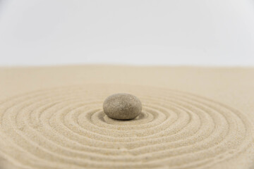 Zen sand garden meditation stone background with copy space. Stones and lines drawing in sand for relaxation. Concept of harmony, balance and meditation, spa, massage, relax. Set Sail Champagne color