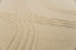 © strigana - Zen sand garden meditation stone background with copy space. Stones and lines drawing in sand for relaxation. Concept of harmony, balance and meditation, spa, massage, relax. Set Sail Champagne color