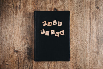 Wall Mural - Holy Bible in block letters on a bible on a wooden table