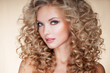 Beautiful blonde woman. Healthy Long Blond Hair. Curly Hair. Permed Hair. Afro curls. Beauty Model Girl with Luxurious Hair.