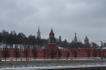 The Red Square. Red brick wall wall. Moscow. Church domes. Kremlin. The Spasskaya Tower.