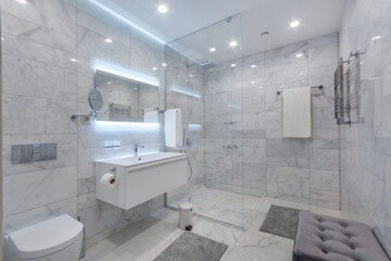 Big modern bathroom with large backlit illuminated mirror, sink, and glass shower