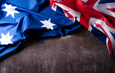 Wall Mural - Happy Australia day concept. Australian flag against old stone background. 26 January.