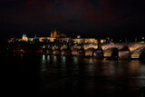Fototapeta Paryż -  prague castle and charles bridge and st. vita church lights from street lights at night
