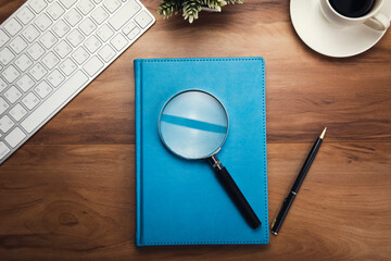 Wall Mural - magnifier on notepad with keyboard