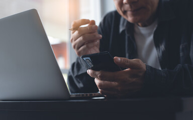 Wall Mural - Business man using mobile phone for video calling , zoom online meeting app during online working from home