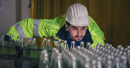 beverage factory production line engineer checking production line