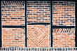 Brickwork and black timber frame pattern in an historic Tudor building Faversham Kent England.