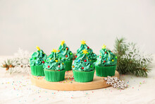 Tasty Christmas Cupcakes On Table