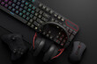 Top view of gamer workspace and gear like mouse, keyboard, joystick, headset