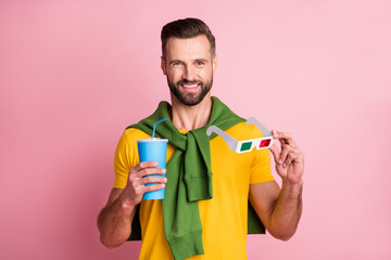 Wall Mural - Photo of charming happy man hold 3d glasses takeaway cup wear tight jumper isolated on pink color background