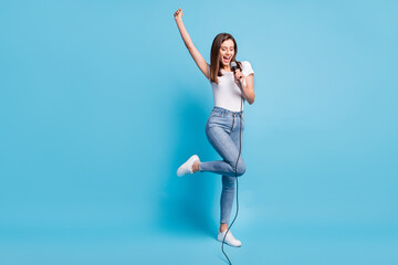 Poster - Full size photo of young charming lovely pretty smiling positive girl singing in karaoke isolated on blue color background