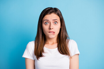 Sticker - Photo of sad guilty young lady wear white clothes biting lip isolated blue color background